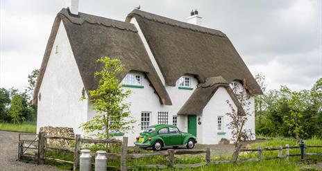 Outside view of Guest House with green car outside