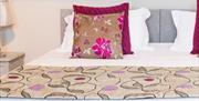 Image of patterned bedding on a double bed