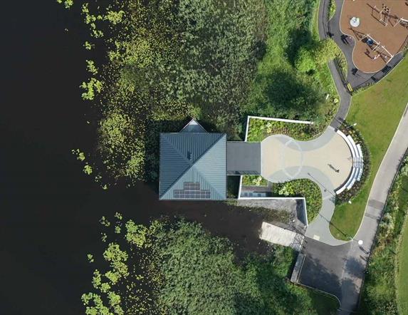 An arial view of round lake visitor centre and play park.