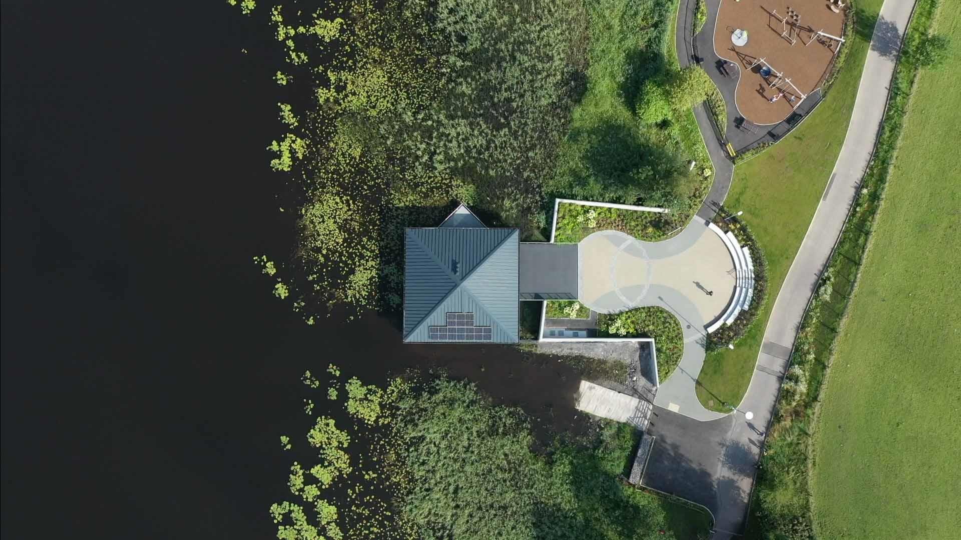 An arial view of round lake visitor centre and play park.
