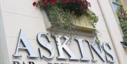 Sign for 'Askins Bar Restaurant'