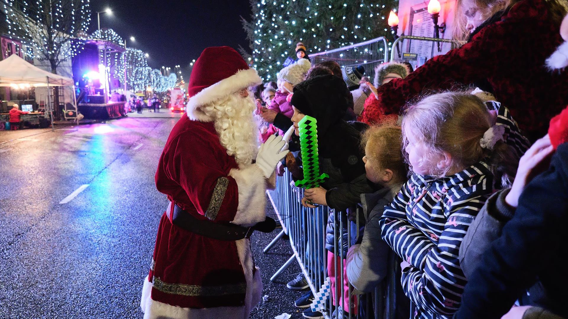 Santa greets a large crowd on the main street of Cookstown