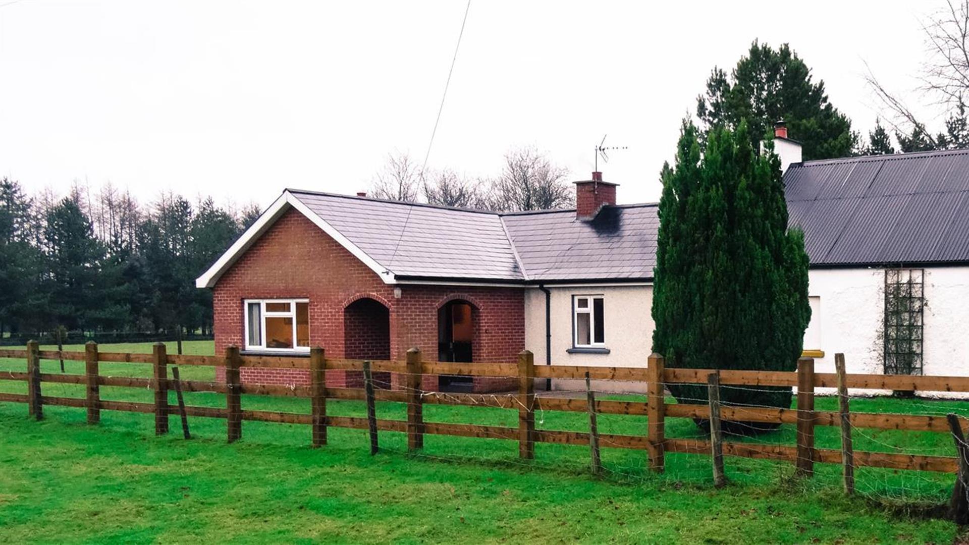 Outside image of house with wooden fence
