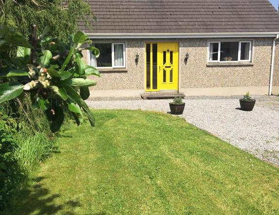 Outside image of house with yellow door