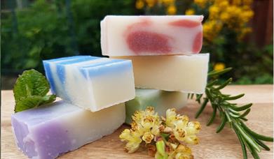 image of three bars of homemade soap stacked on top of each other