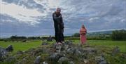 Two living history characters acting on Beaghmore Stone Circles