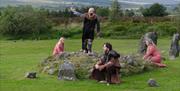 Four living history characters performing at Beaghmore Stone Circles