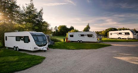 Caravans at Dungannon park in the evening sun.