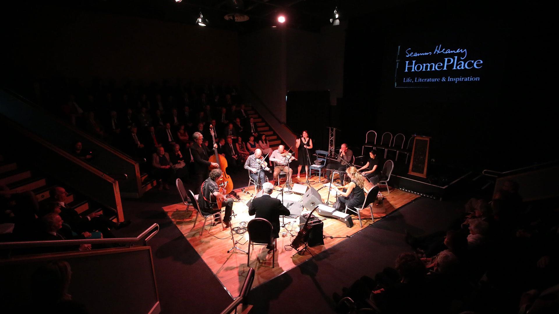 A group of musicians in the Helicon performance space at Seamus Heaney HomePlace