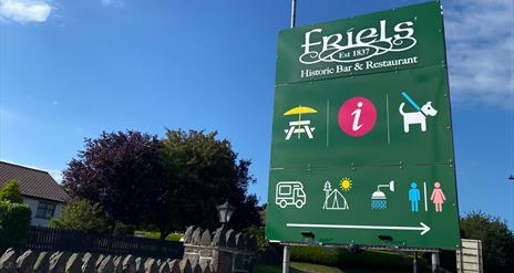 A picture of a sign post for Friels Bar and Restaurant
