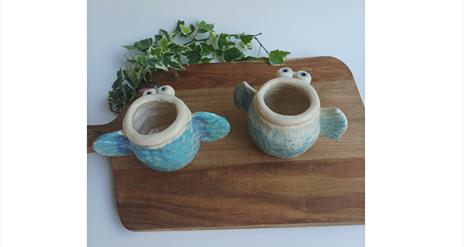 Image of two pots that look like fish