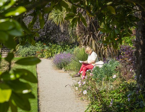 Woman taking a moment to reflect in Castle Ward's Sunken Garden