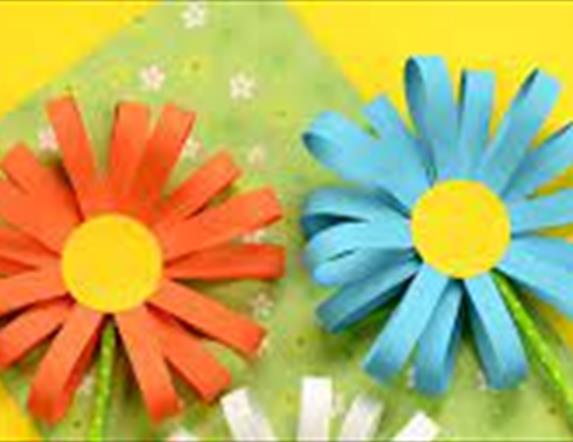 Three daisy flowers made out of paper