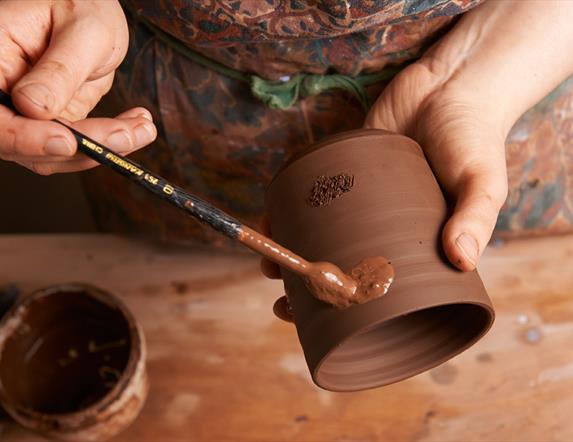 painting pottery at Down Arts Centre