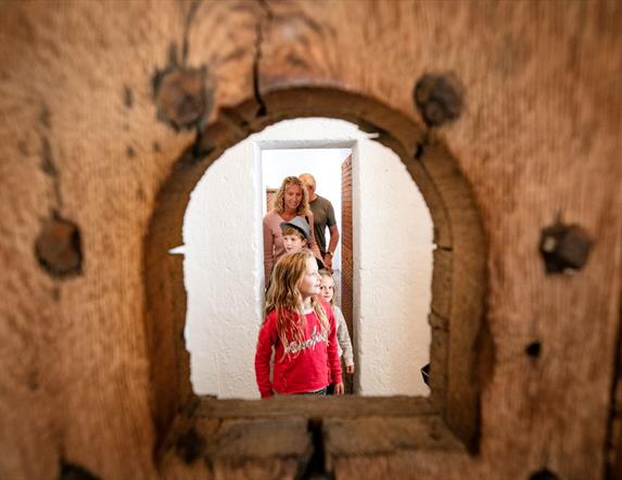 Family exploring restored Gaol cells at Down County Museum