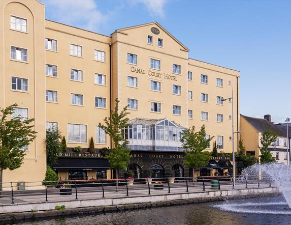 View of the front of the Canal Court Hotel and Spa building, fountain also in the picture.