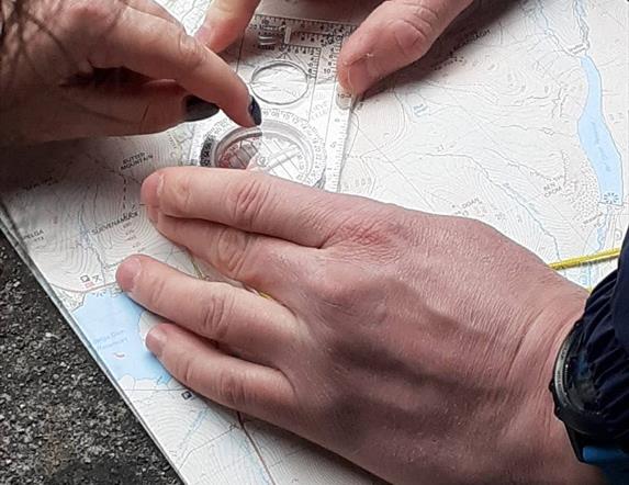 Compass practice on navigation skills course in the Mournes