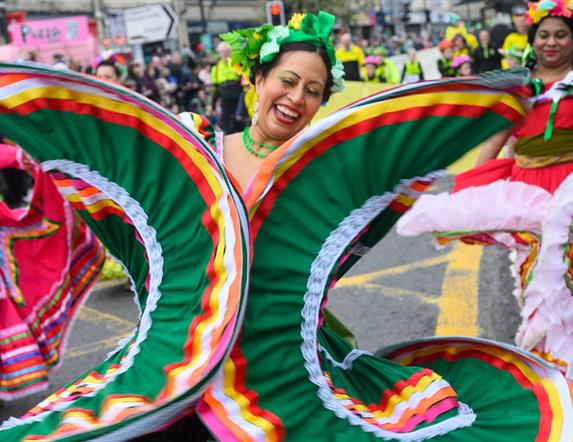 Performers walking down Market Street in Downpatrick as part of the St Patrick's Day parade.