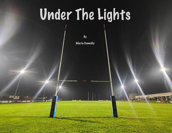 Image showing the goal post at night with the floods turned on. Under the lights by Maria Connolly