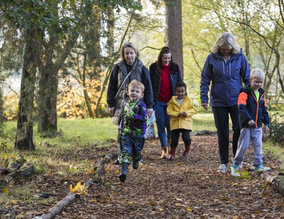 Boy running on Halloween Trail with Family