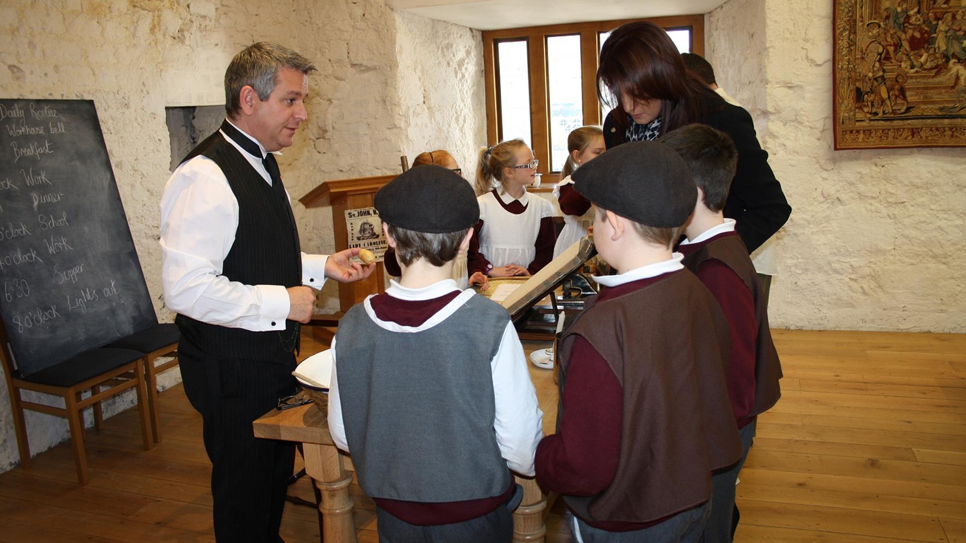 An image of children learning at the St Patrick's Crossmaglen Workhouse.