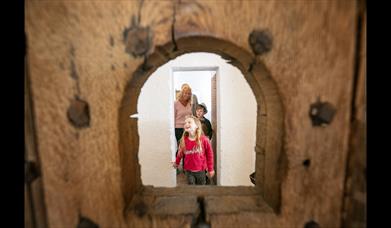 A family exploring the restored cell block