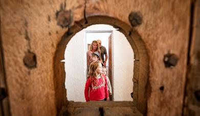 Family exploring restored Gaol cells at Down County Museum