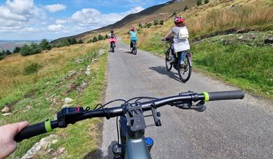 4 people cycling on roads around Slieve Gullion.
