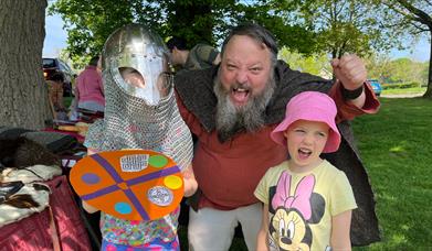 A viking with two children at Delamont Country Park