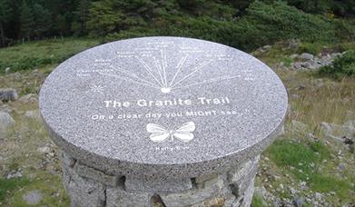Stone with writing "The Granite Trail"