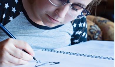 A person bird sketching in Castlewellan Forest Park