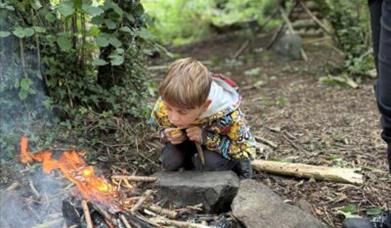 Child at open flame, bushcraft