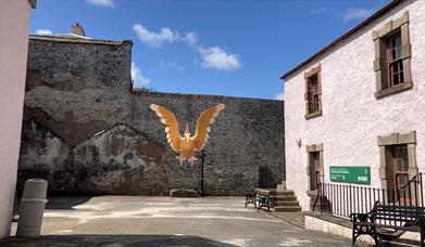 A Fearow in the museum courtyard