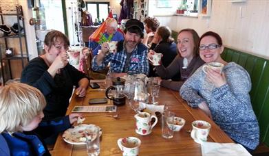 Group of friends at table enjoying food