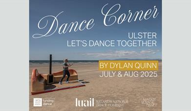 An image of Dylan dancing on his purpose built dance corner, on a sandy beach with the tide on the horizon.
