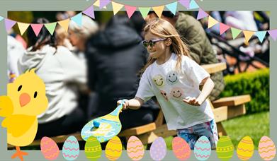 Image of young girl playing bat and ball in Montalto Estate, with Easter animated graphics