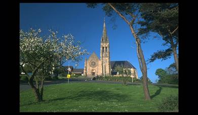 St Patrick's Church, Downpatrick with grass area and trees