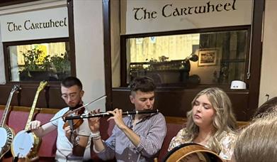 Mad for Trad | Ring of Gullion Autumn Fest. Group of musicians playing together as part of the festival.
