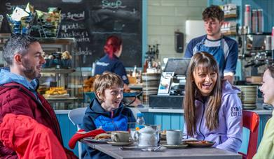 Family of four enjoying breakfast at Synge and Bryne - Kilbroney Park