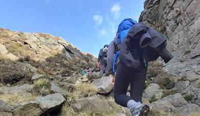 hard at it, reaching the top