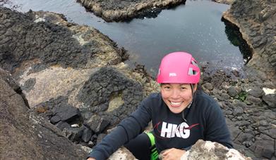 Getting to the top on an amazing sea cliff rock climb!