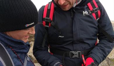 reading the map in the Mournes on a navigation course with Geology Rocks Adventure