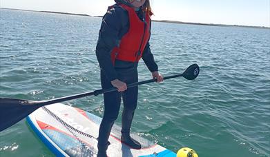 woman paddle boarding at castlewellan