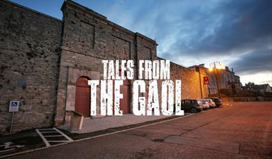 An exterior shot of Down County Museum with the text "Tales from the Gaol" overlaid