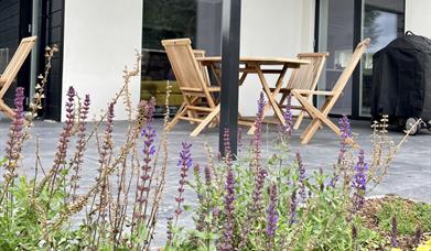 covered patio in the walled garden with Weber BBQ