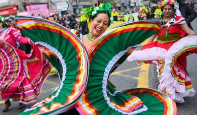 Performers walking down Market Street in Downpatrick as part of the St Patrick's Day parade.