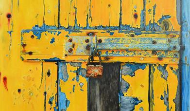 yellow gate with a lock