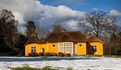 Image credit: Alan Hopps
Derrymore house. A bright yellow cottage with a thatched roof.
