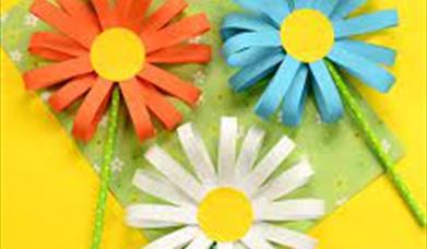 Three daisy flowers made out of paper