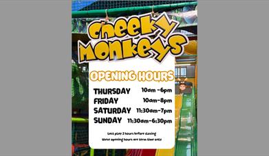 Poster showing opening times of cheeky monkeys play area